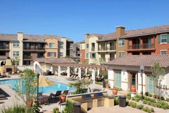 an apartment community's swimming pool and outdoor area
